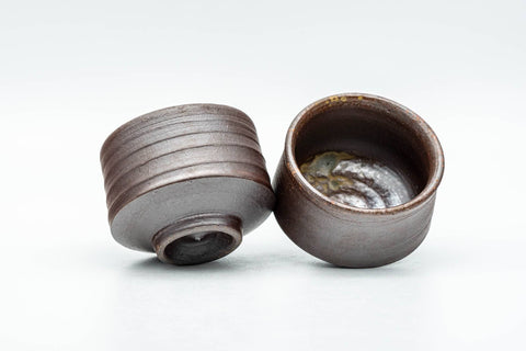 Tezumi — Japanese Teacups - Pair of Brown Spiraling Stoneware Guinomi - 40ml — three-quarter view