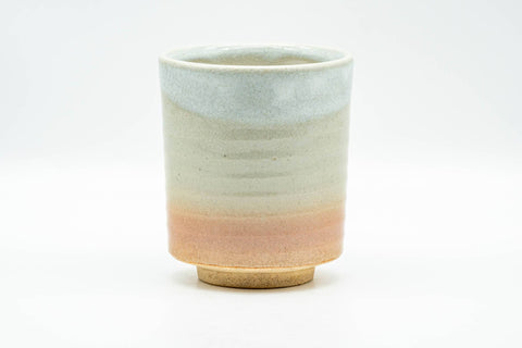 Beige, peach and white glazed Hagi-yaki yunomi teacup - front view, slightly angled