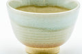 Close front view of a Hagi teacup emphasising the soft glaze and subtle tonal variation.