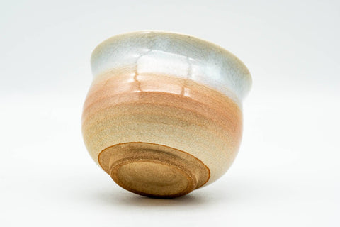 Japanese Teacup - Tsubaki Kiln Beige White Glazed Hagi-yaki Yunomi - 140ml - low-angle view showing the base and peach gradient