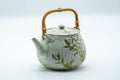 Tezumi — Japanese Tea Set - Beige Speckled Floral Kiyomizu-yaki Dobin Teapot with 5 Yunomi Teacups — the teapot in three-quarter view
