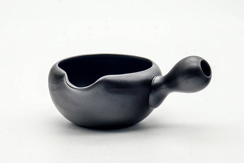 Opposite profile of the water cooler showing the spout and rounded black body.