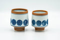 Tezumi — Japanese Teacups - Pair of Blue Orange Geometric Arita-yaki Meoto Yunomi — front view