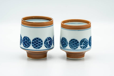 Tezumi — Japanese Teacups - Pair of Blue Orange Geometric Arita-yaki Meoto Yunomi — front view