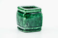 Front view of the square, ring-form futaoki with a glossy green glaze.