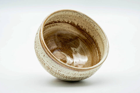 Overhead view looking into the chawan, showing the spiral rings and milky glaze inside
