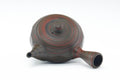 Top view showing the lid, knob, and a red ring of nerikomi clay.