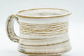 Tezumi — Japanese Teacup - Carved Exterior White Glazed Rear-Handled Ushirode Yunomi - 110ml — tipped to show the interior