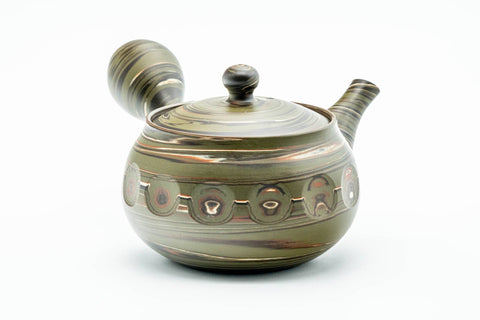Angled view with the side handle at right and the spout to the lower left.