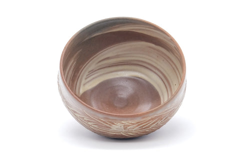Pink-white hakeme chawan seen from above, looking into the brushed-slip glazed interior