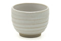 Tezumi — Japanese Teacup - Simple Spiraling Beige Yunomi - 100ml — tipped to show the interior