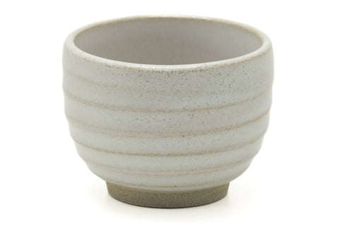 Tezumi — Japanese Teacup - Simple Spiraling Beige Yunomi - 100ml — tipped to show the interior
