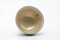 Overhead view into the cup, with the floral decoration visible around the exterior.