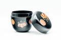 Japanese Natsume - Chrysanthemum Floral Black Lacquer Matcha Tea Caddy - 100ml - caddy with the lid removed beside it, showing the floral motif