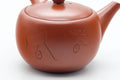 Tezumi — Japanese Tea Set - Kanji Engraved Tokoname-yaki Kyusu Teapot with 5 Yunomi Teacups — closeup of the decoration