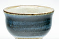 Tezumi — Japanese Teacup - Black Blue Glazed Exterior Beige Interior Yunomi - 70ml — tipped to show the interior