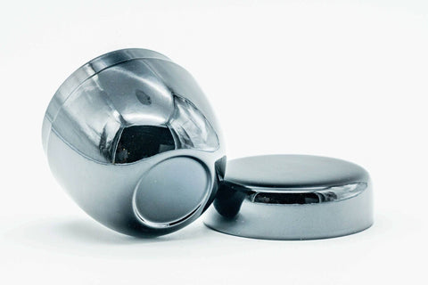 The small natsume tipped on its side with the lid set beside it.
