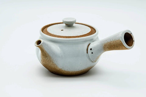 Front view of the white kyusu showing the spout, lid on.