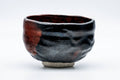 Tezumi — Japanese Matcha Bowl - Black Red Glazed Kuro-Raku Chawan - 300ml — tipped to show the interior