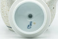 Tezumi — Japanese Tea Set - Blue Floral White Matte Glazed Arita-yaki Debeso Kyusu Teapot and 5 Yunomi Teacups — closeup of the decoration