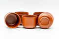 Overhead view of the teapot and cups looking down on the lid and grouped teacups.