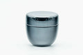 Small black lacquer natsume caddy with lid on, shown at a three-quarter angle.