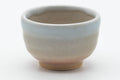 Tezumi — Japanese Teacup - Small Beige White Glazed Hagi-yaki Guinomi - 40ml — tipped to show the interior