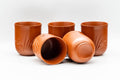 Japanese Tea Set - Long Grass Engraved Tokoname-yaki Debeso Kyusu Teapot with 5 Yunomi Teacups - the five teacups with one tilted to show the interior