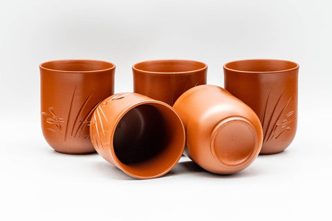 Japanese Tea Set - Long Grass Engraved Tokoname-yaki Debeso Kyusu Teapot with 5 Yunomi Teacups - the five teacups with one tilted to show the interior