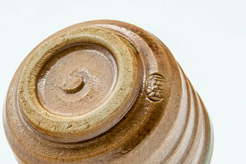 Tezumi — Japanese Teacup - Orange Green Spiraling Shigaraki-yaki Guinomi - 30ml — inverted showing the foot ring
