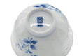 Tilted underside view showing the base, blue mark and floral decoration.