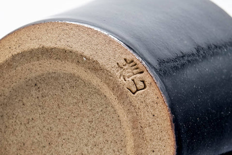 Tezumi — Japanese Teacup - Black Beige Drip-Glazed Ushirode Yunomi - 100ml — closeup of the glaze