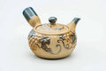 Side view of the grapevine kyusu with the handle to the right, lid on.