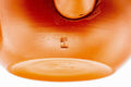 Underside of the wide red kyusu showing the foot and maker's mark.