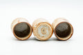 The yunomi tipped on its side to reveal the dark glazed interior and unglazed stamped foot.