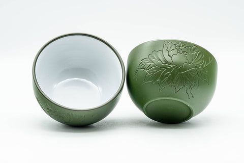 Japanese Teacups - Pair of Green Ryokudei Tokoname-yaki Yunomi - 120ml - front view of the pair, one cup tilted to show the white glazed interior