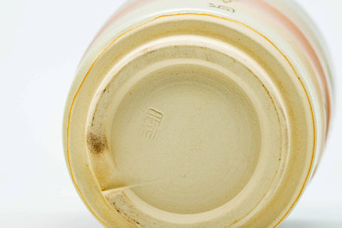 Underside of a cup, showing the foot.