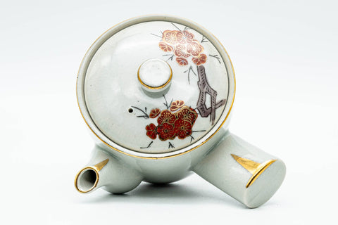 Top-down angled view of the lidded kyusu showing the floral lid and knob.