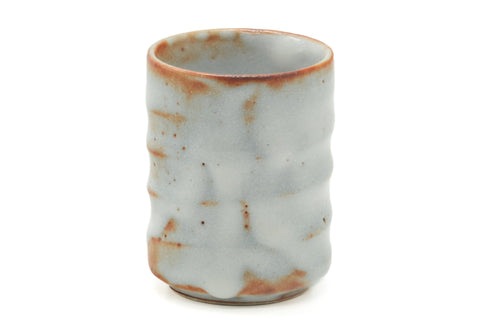 Tezumi — Japanese Teacup - Orange White Glaze Yunomi - 110ml — tipped to show the interior