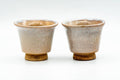 The two Hagi-yaki sake cups viewed from a slightly raised angle