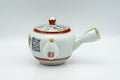 Tezumi — Japanese Tea Set - Geometric Script Kutani-yaki Debeso Kyusu Teapot with Katakuchi Water Cooler and 5 Yunomi Teacups — the teapot side view with the handle