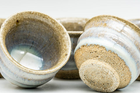 Japanese Teacups - Set of 5 Blue Milky White Drip-Glazed Guinomi - 35ml - set with one cup tilted to show the footring