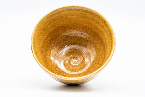 Overhead view into the Ki-Seto bowl, showing the spiralling interior and pooled yellow glaze at the well.