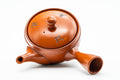 Overhead view of the domed lid and central knob on the brick-red body.