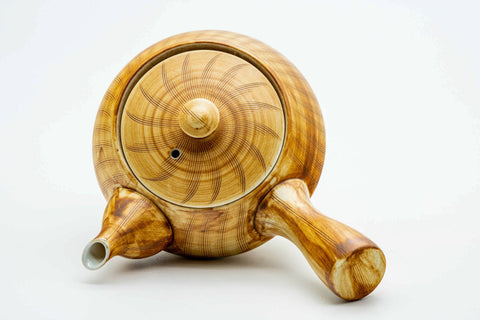 Overhead view of the kyusu, lid on, showing the handle and spout.