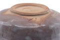 Close-up of the Mino-yaki chawan base, showing the pale unglazed clay foot and footring