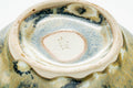 Close-up looking into the interior where the glaze pools at the base.