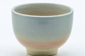 Tezumi — Japanese Teacup - 天鵬山 Tsubaki Kiln - Classic Beige Hagi-yaki Yunomi - 80ml — tipped to show the interior