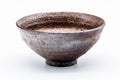 Tenmoku-shaped chawan with a textured brown glaze, viewed from the front showing its conical flaring form.