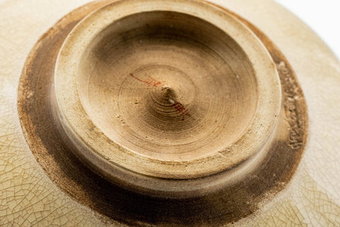Tilted view of the Kutani chawan showing the foot and crazed glaze